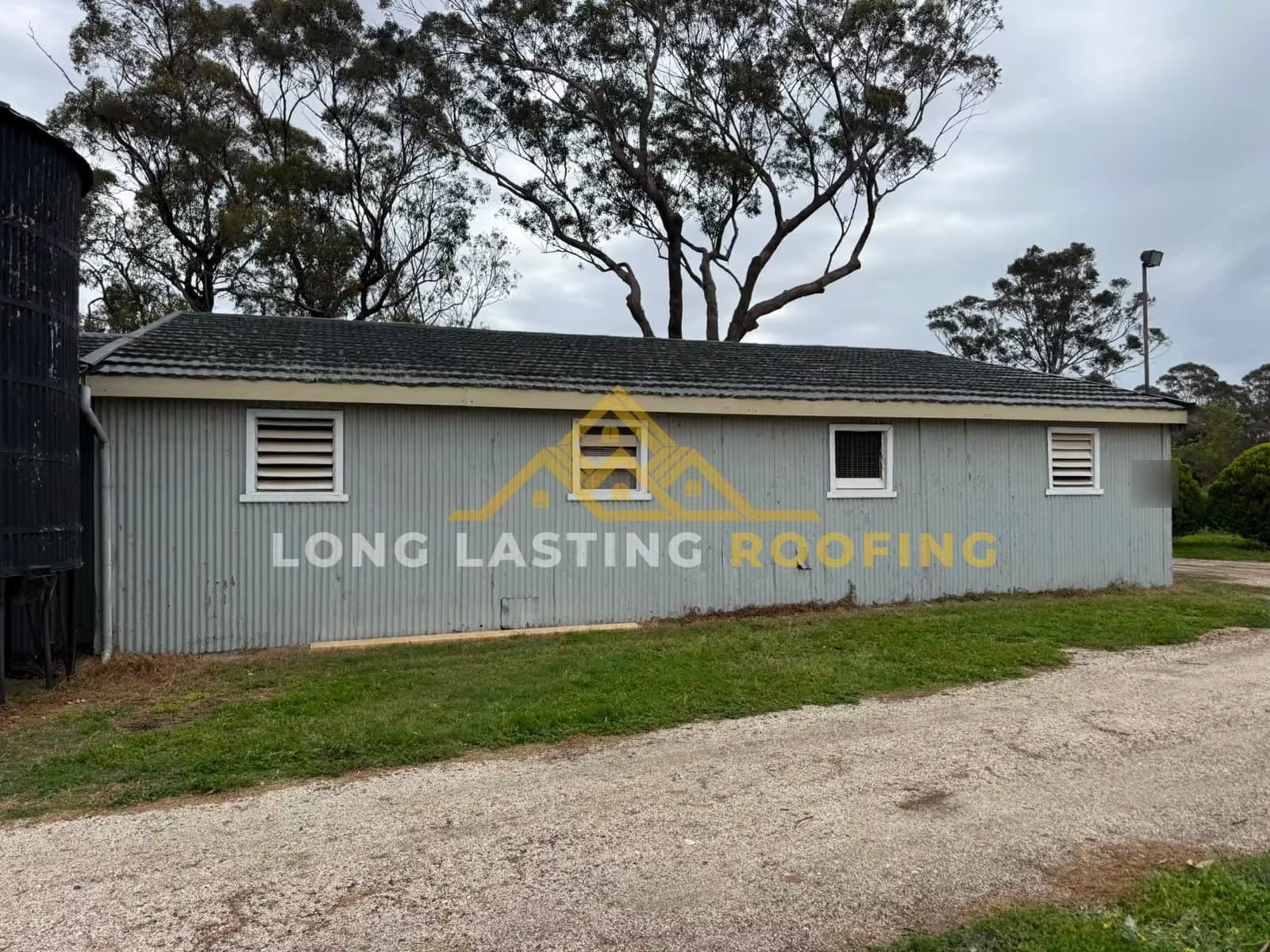 Colorbond gutter installation on a long single-storey building in Wallan