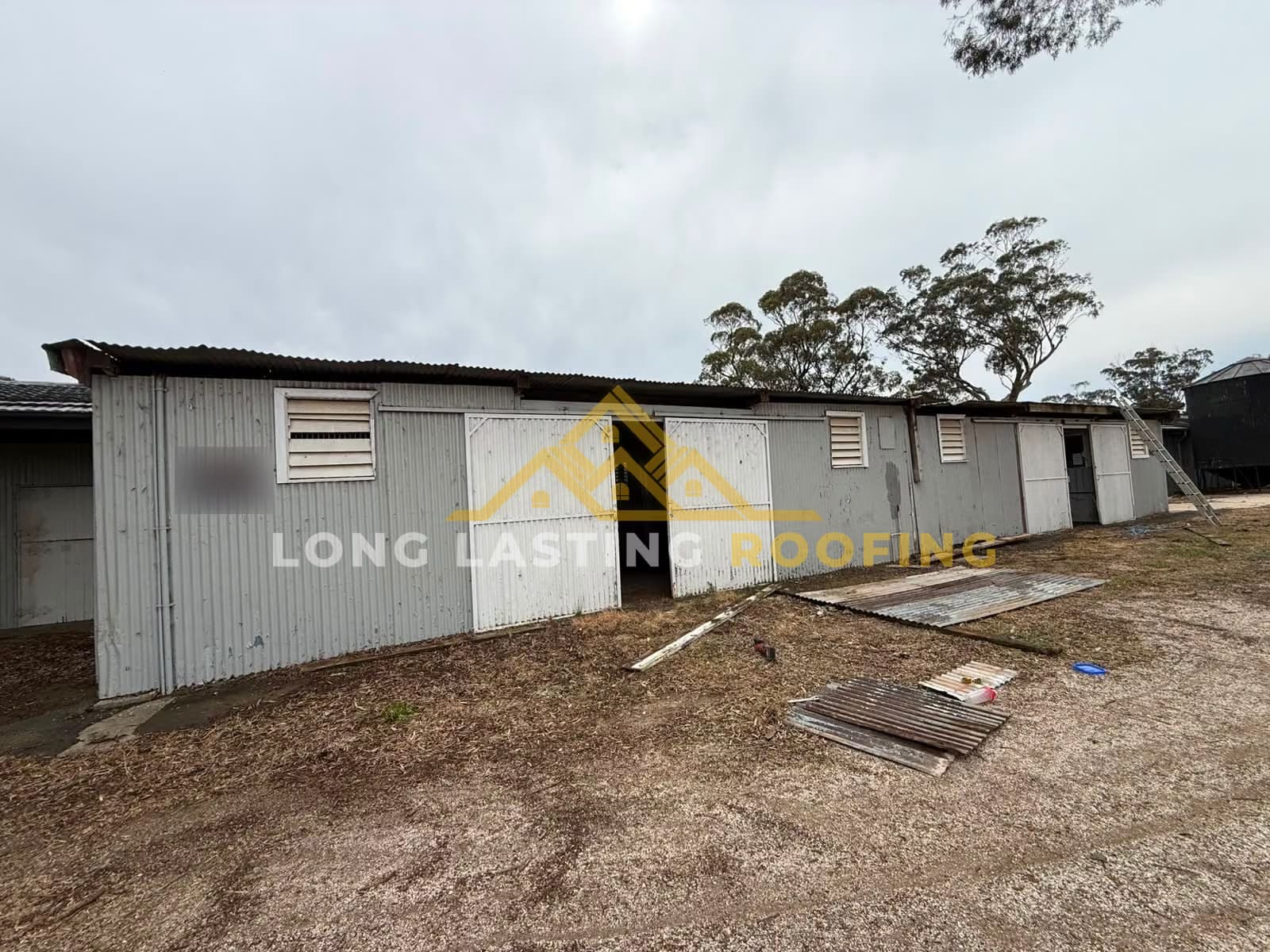 Existing gutter removal work on a corrugated-metal building in Wallan Victoria