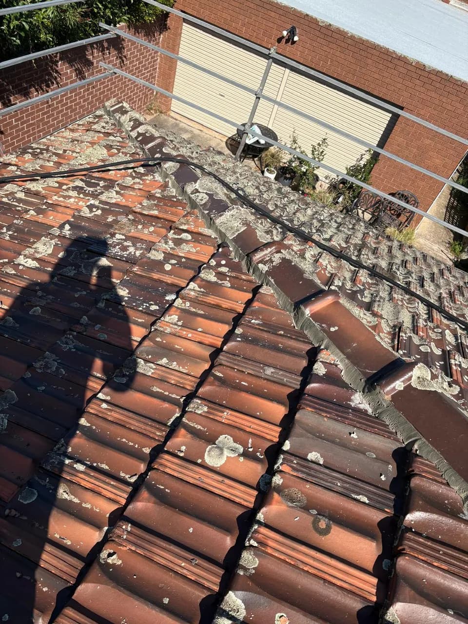 Ridge Capping Stripped for Repair in Oak Park, Melbourne